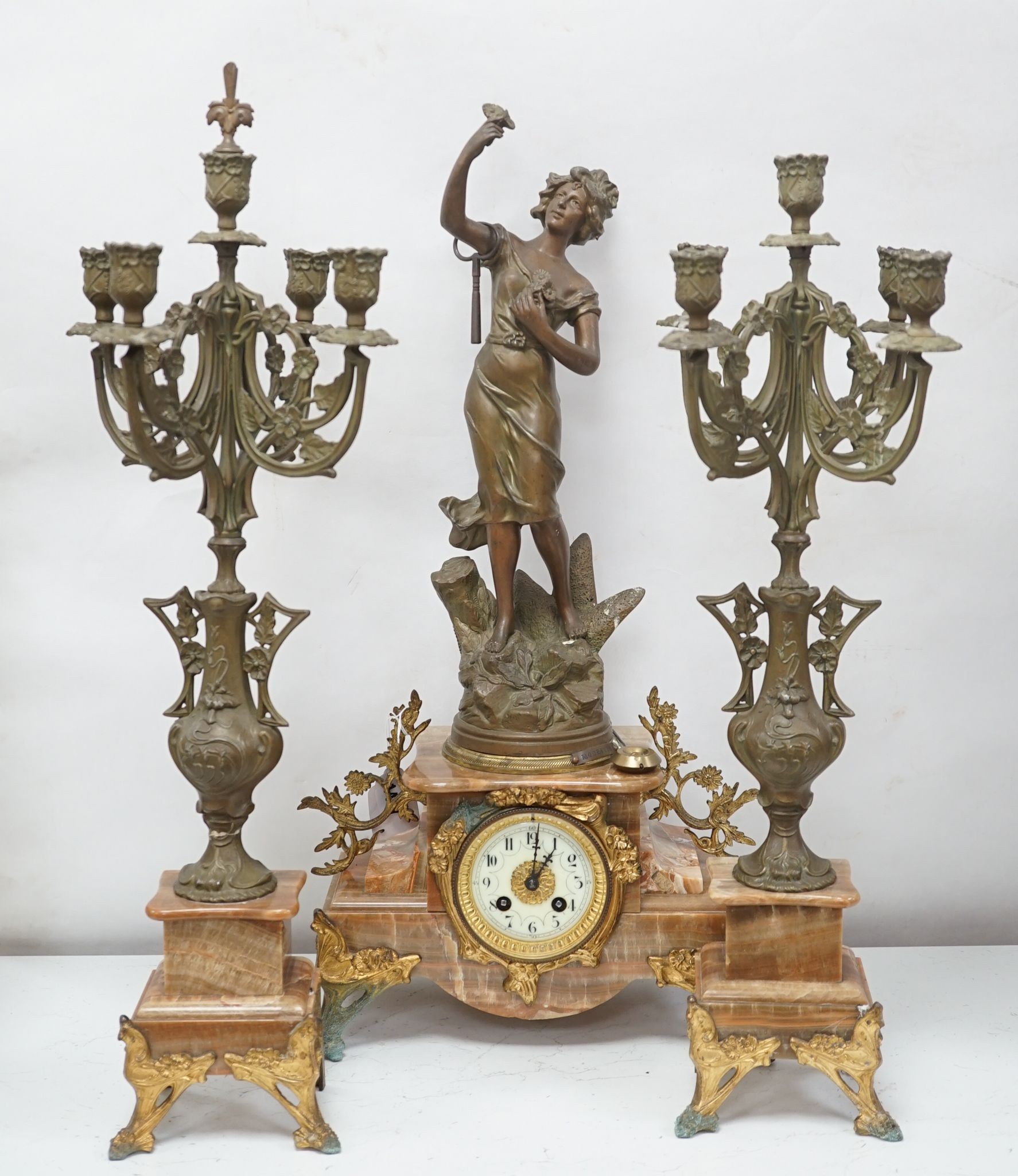 A French onyx and spelter figural clock garniture 66cm